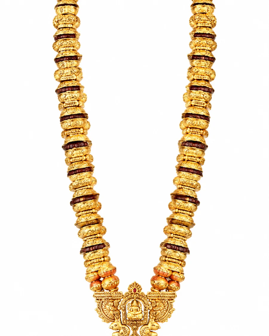 Long haram of carved gold beads